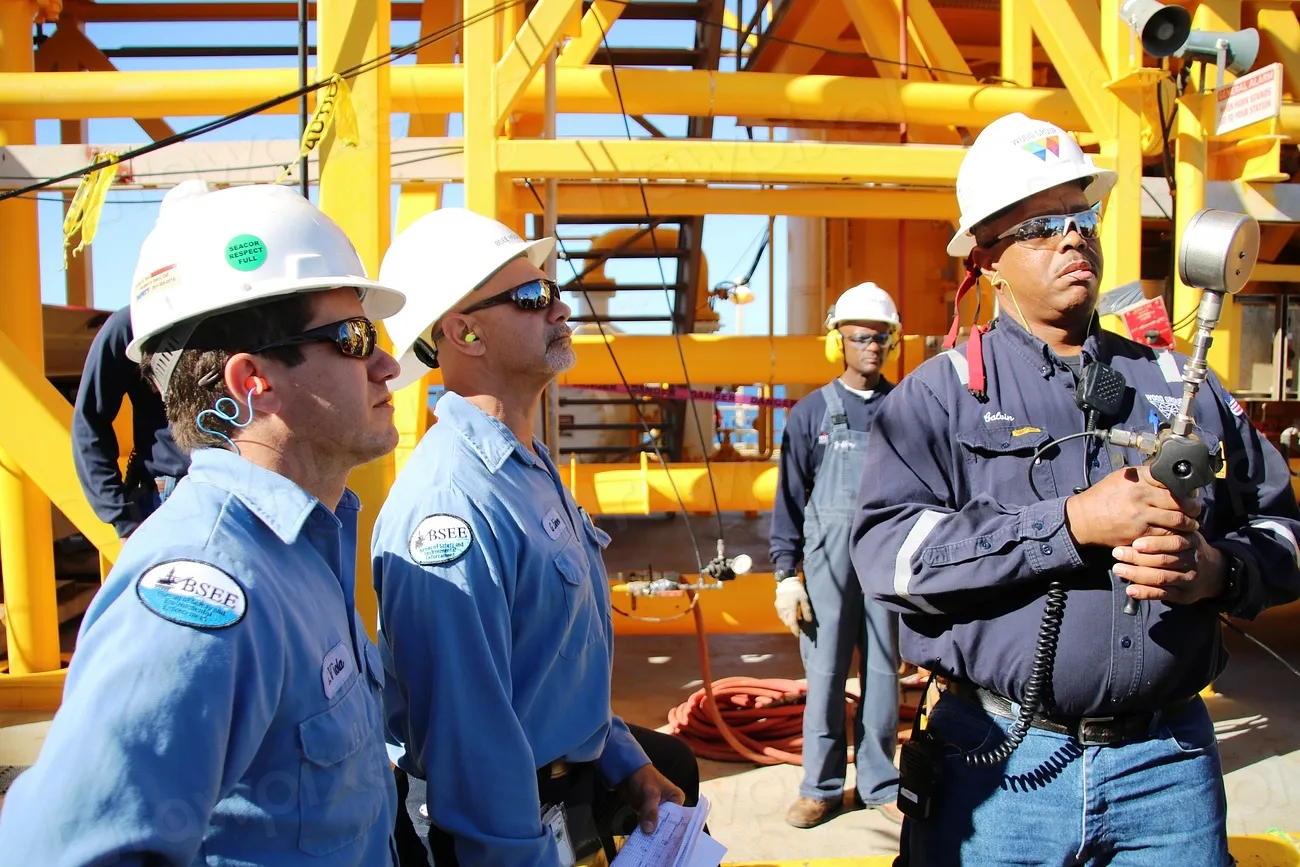 Engineers in hard hats on an industrial site